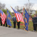 Veterans holding Michigan & U.S. Flags