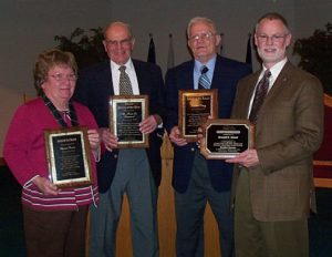 Photograph of the local winners Sharon Fenton/Alma, Dr. Rex Rimmel/Ithaca, Norris Bay/St. Louis, and Don Schurr/Greater Gratiot Development
