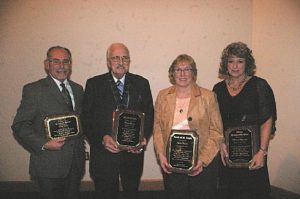 Photograph of Chamber President's Award winner Craig Zeese, Alma Tartan Award winner Duane Stacey, Spirit of St. Louis winner Jane Keon, and Ithaca Person of the Year Marci Browne.