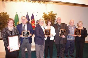 A photograph of local award winners Pat Earegood, Dave Roslund, Charlie & Marlene Teegardin, Larry Mott, and Gary & Lou Irivin. Photo courtesy of the Gratiot County Herald.