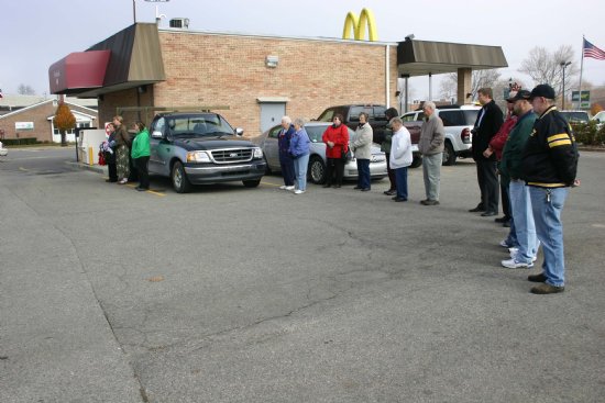 People infront of McDonalds' Shop